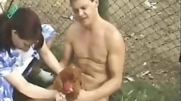 Drunk guy fucking a chicken outdoors