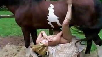 Girl has sex with horse with legs spread